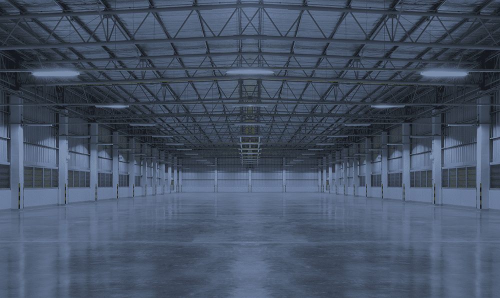 Empty industrial building with overhead lights